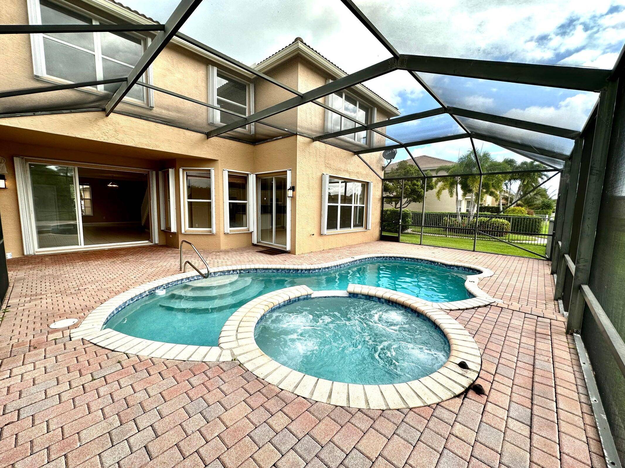Stunning Waterfront 6 Bedroom 4 Bathroom Pool Home on Lake, with 3 Car Garage !