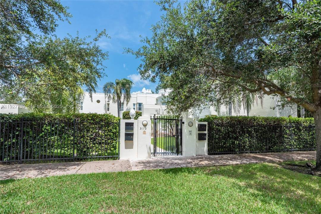 This one of a kind 2 story townhome is tucked away on a quiet, tree lined street and yet steps away from downtown Coral Gables.