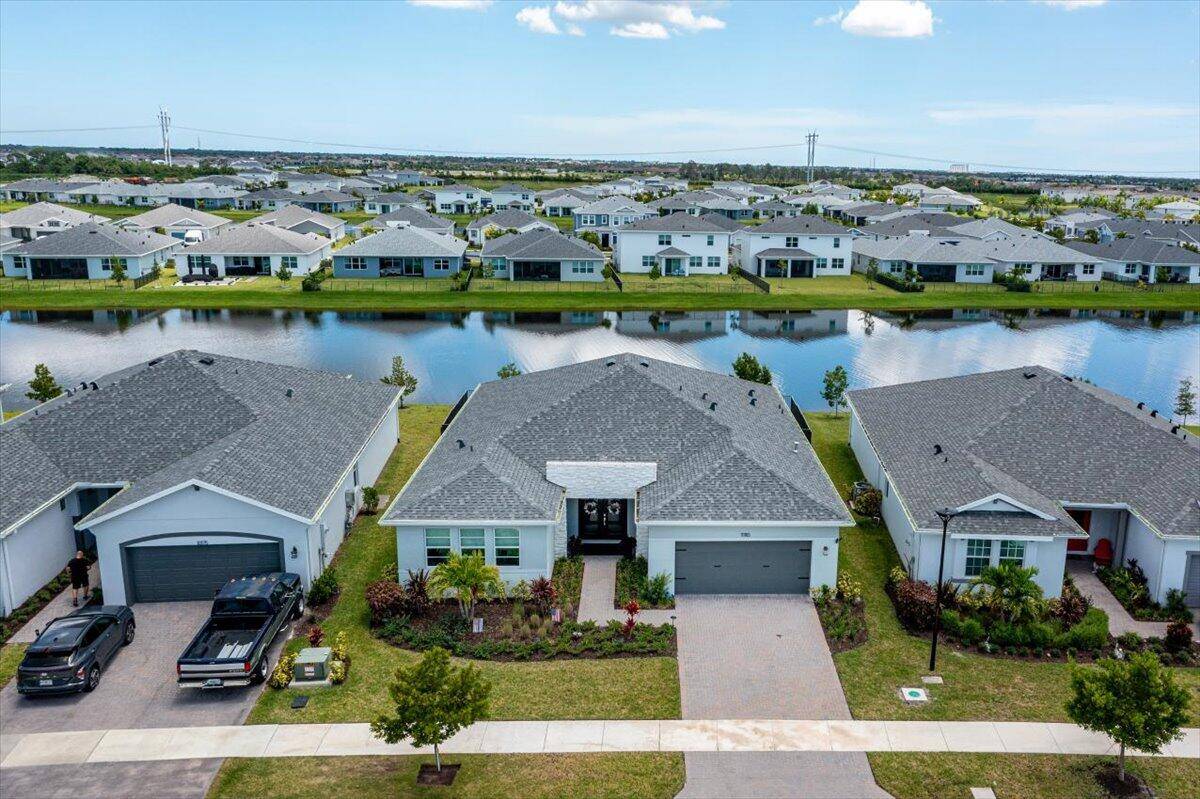 Welcome to this stunning 4 bedroom, 3 bath, 2 car garage lakefront home in the heart of Tradition !