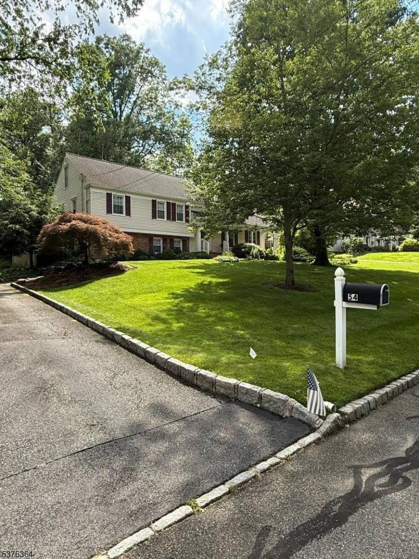 Nestled in the heart of a serene and prestigious neighborhood this split level home offers the perfect blend of timeless elegance and modern comfort.