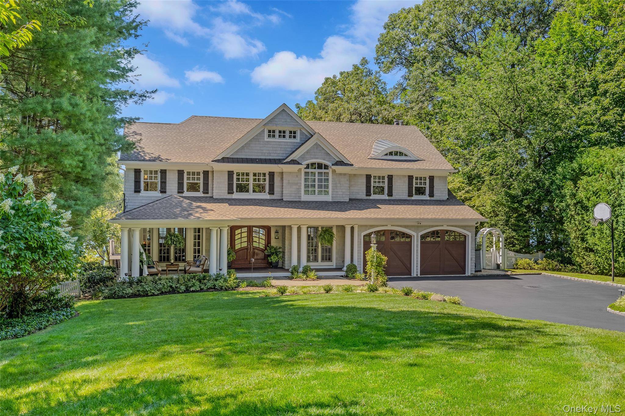 Beautiful waterfront Hampton style colonial combines elegant casual living with everyday functionality set on a quiet street with mature designer landscaping, inground pool, mooring rights and stunning views.