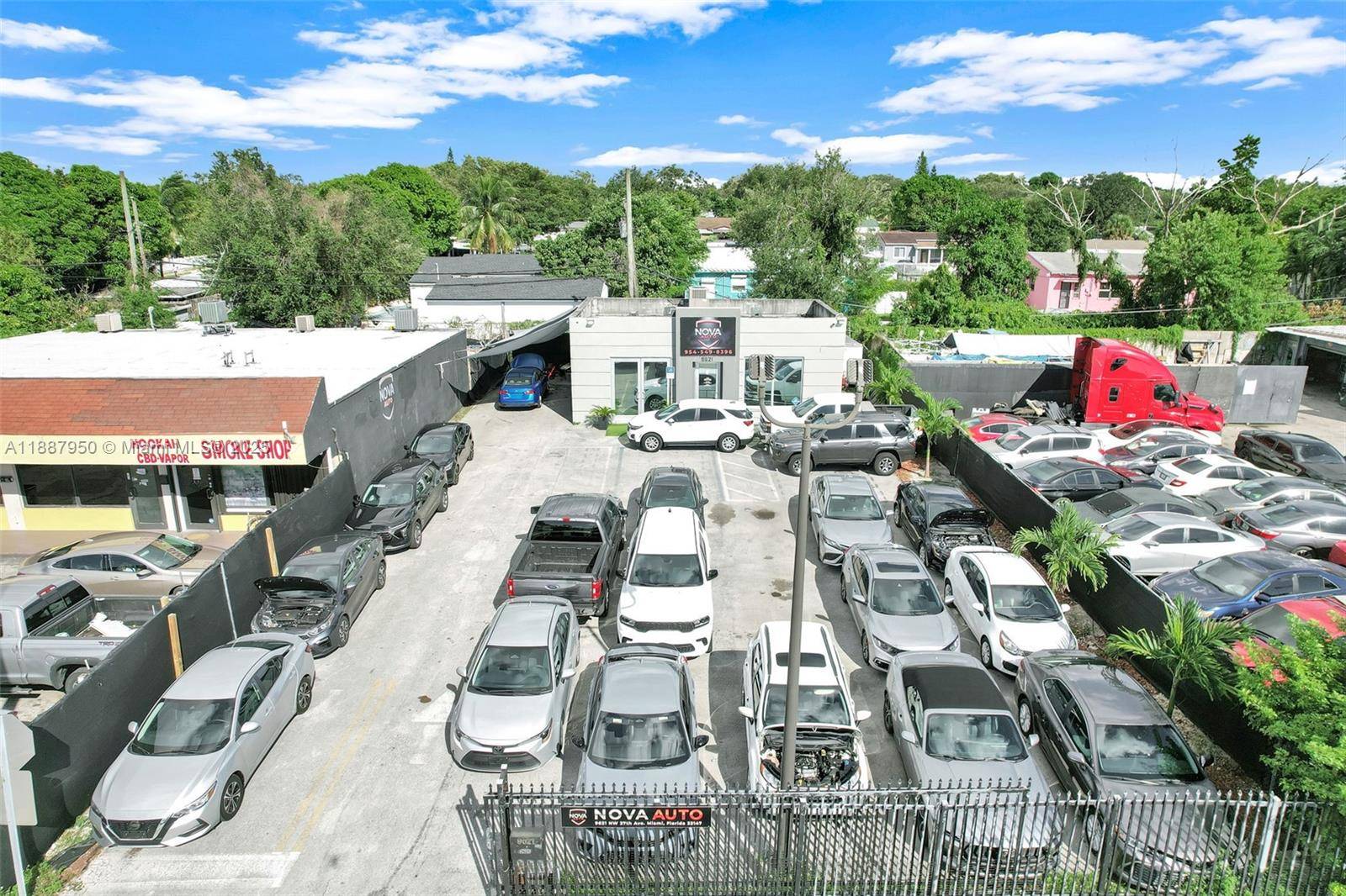 This unique property features 6, 960 square feet of paved lot space, currently operating as a car dealership with 20 to 25 cars, along with a 909 square foot, one ...