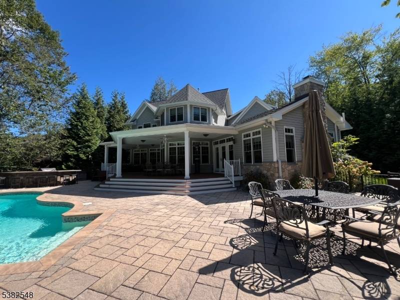 Stunning colonial on Pines Lake with year round water views !