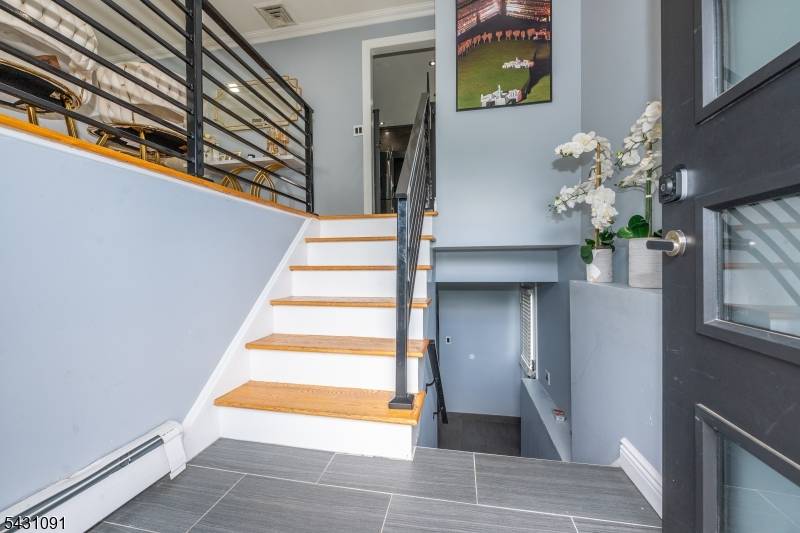 Exceptional custom renovated residence showcasing modern elegance and impressive curb appeal.