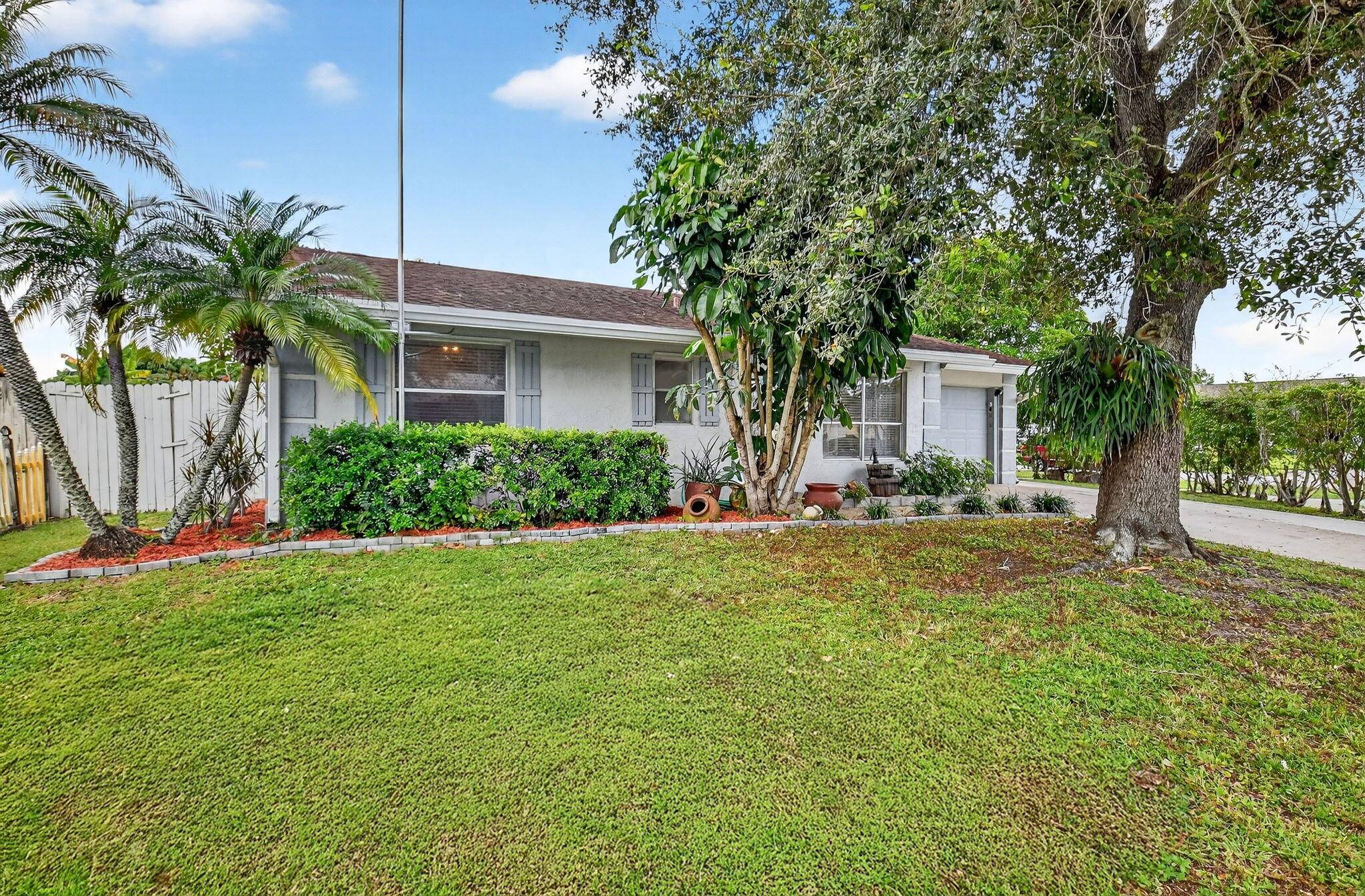 Welcome to 6533 Athena Drive, a beautifully updated corner lot home that captures the essence of South Florida living !