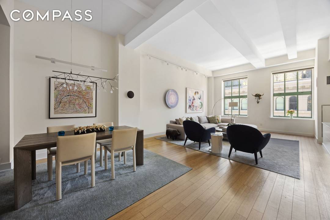 Currently configured as a three bedroom, this loft style residence offers a flexible and well proportioned layout complemented by 12 foot beamed ceilings and oversized rooms throughout.