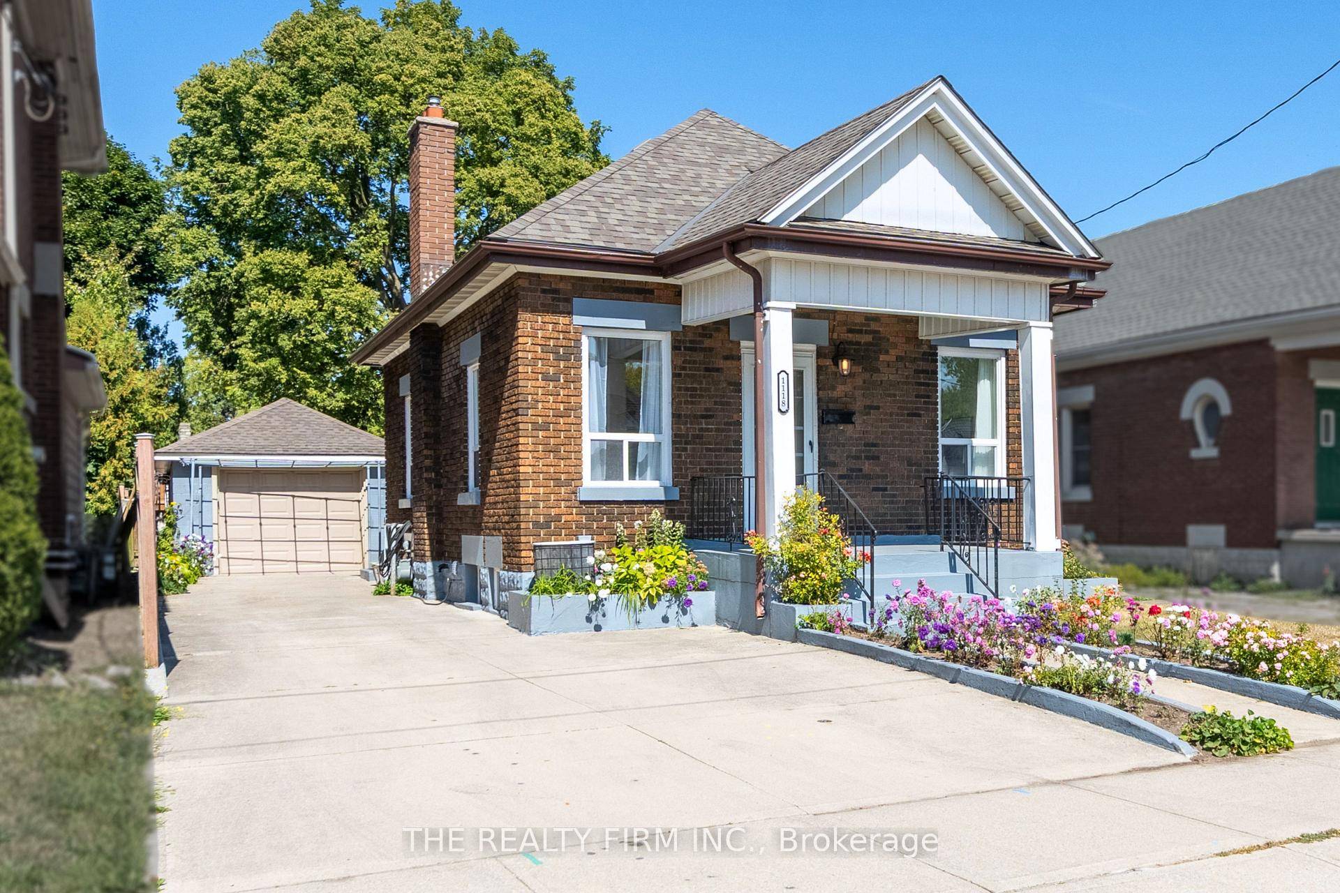 Welcome to 1118 Trafalgar Street, London a beautifully updated bungalow offering 2 bedrooms, 2 full bathrooms, a single car garage, and plenty of parking on the concrete driveway.