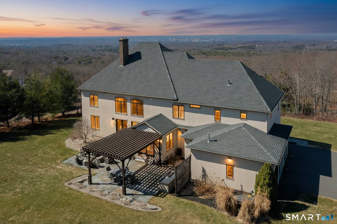 Custom Catarino built French Country residence, located on a cul de sac in an enclave of fine homes, seamlessly blends rustic charm with modern elegance.