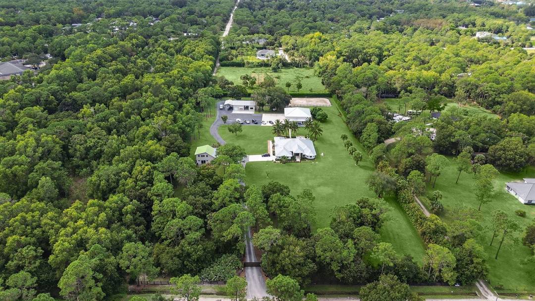 Welcome to a rare estate of distinction in the heart of Jupiter Farms 17593 Winterhawk Trail, a 5.