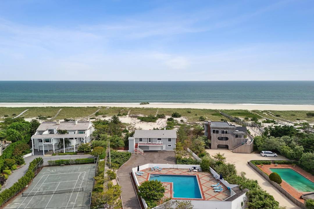Oceanfront on Dune Road, this updated beach cottage offers over 100 feet of direct ocean frontage and sits on an acre with sweeping views of both the ocean and the ...