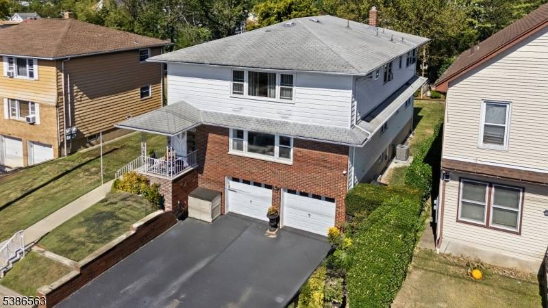 Elegant Two Family Home Steps from NYC Transit Train Station !