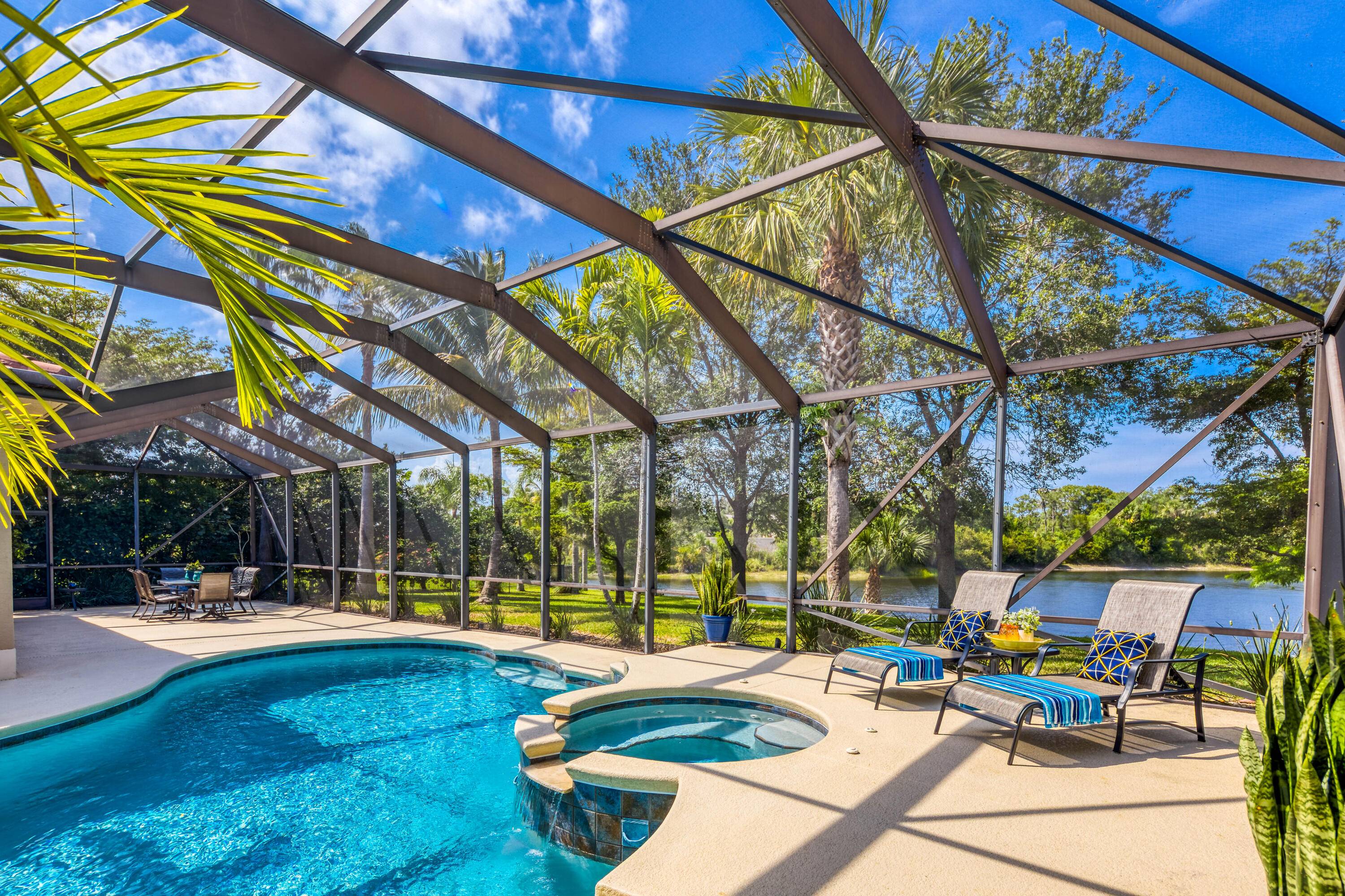 Stunning Lakefront Custom Pool Home on a Half Acre Lot is Turnkey ready for you !