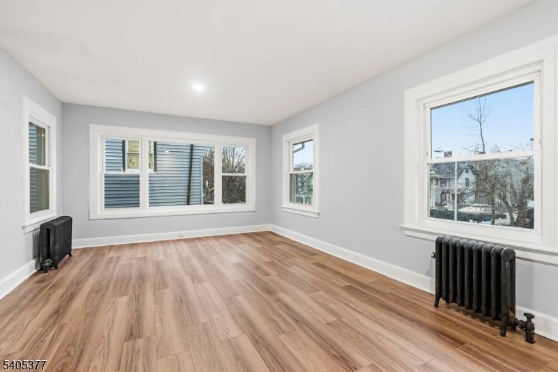 This stunning and spacious two family home offers the perfect blend of classic charm, modern convenience, and excellent investment potential.