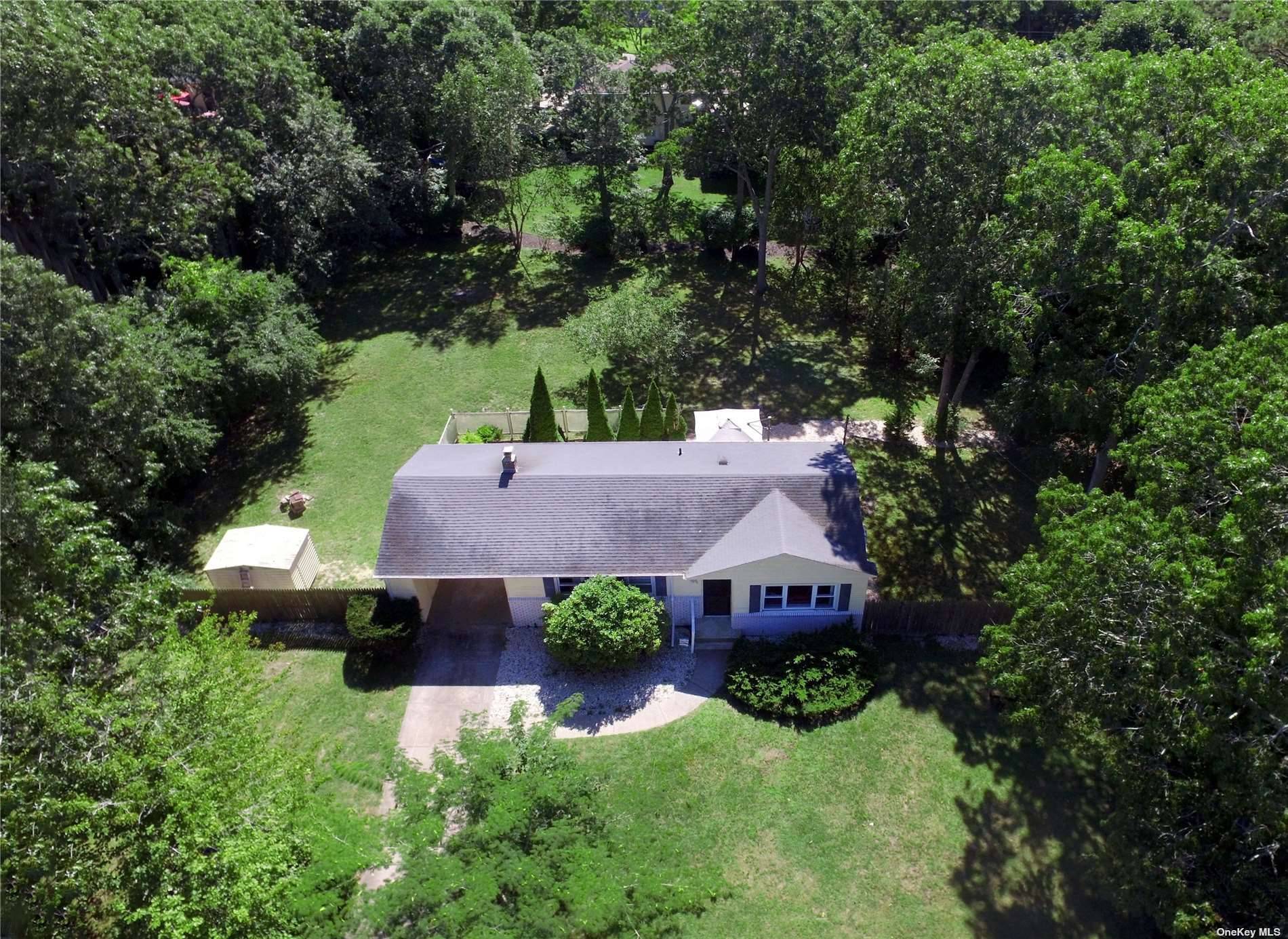 Sun Drenched neat as a pin Three Bedroom one bath ranch in the popular Tiana Shores Section of Hampton Bays.