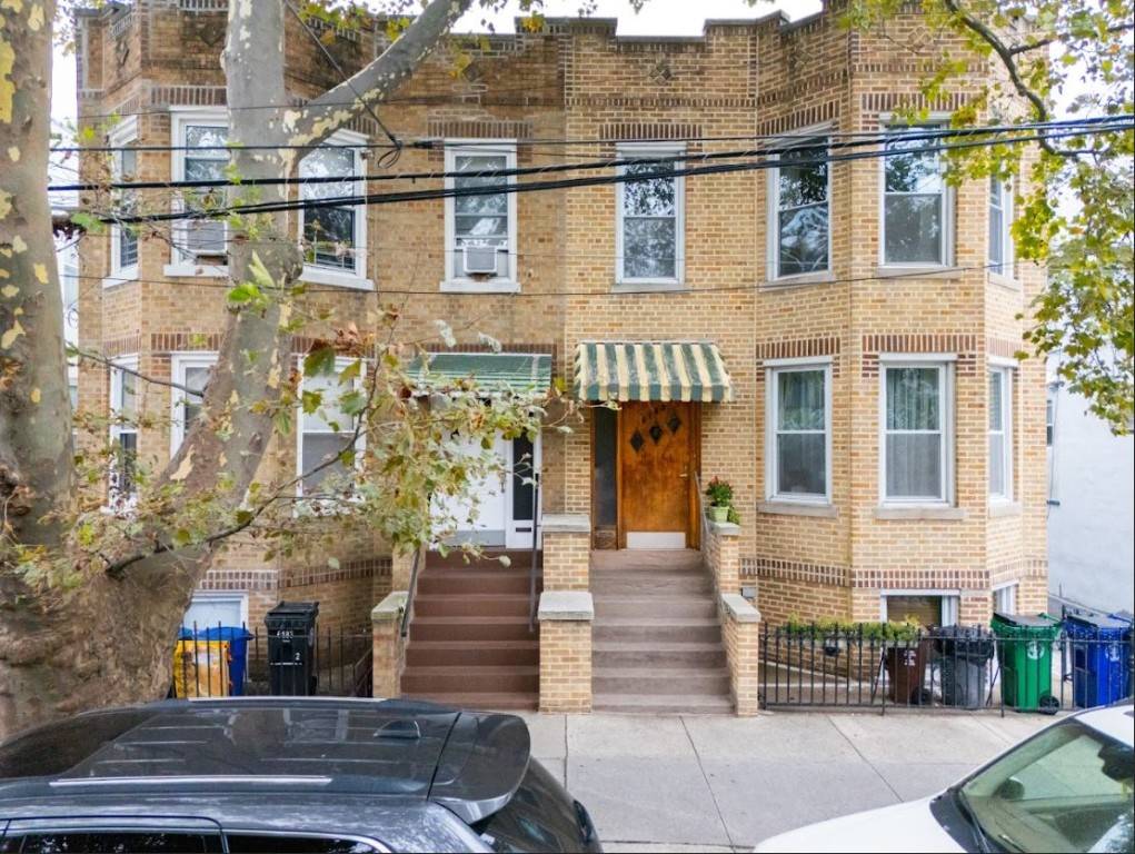 Beautifully maintained Semi Detached Brick 3 Family with Detached 2 Car Garage.