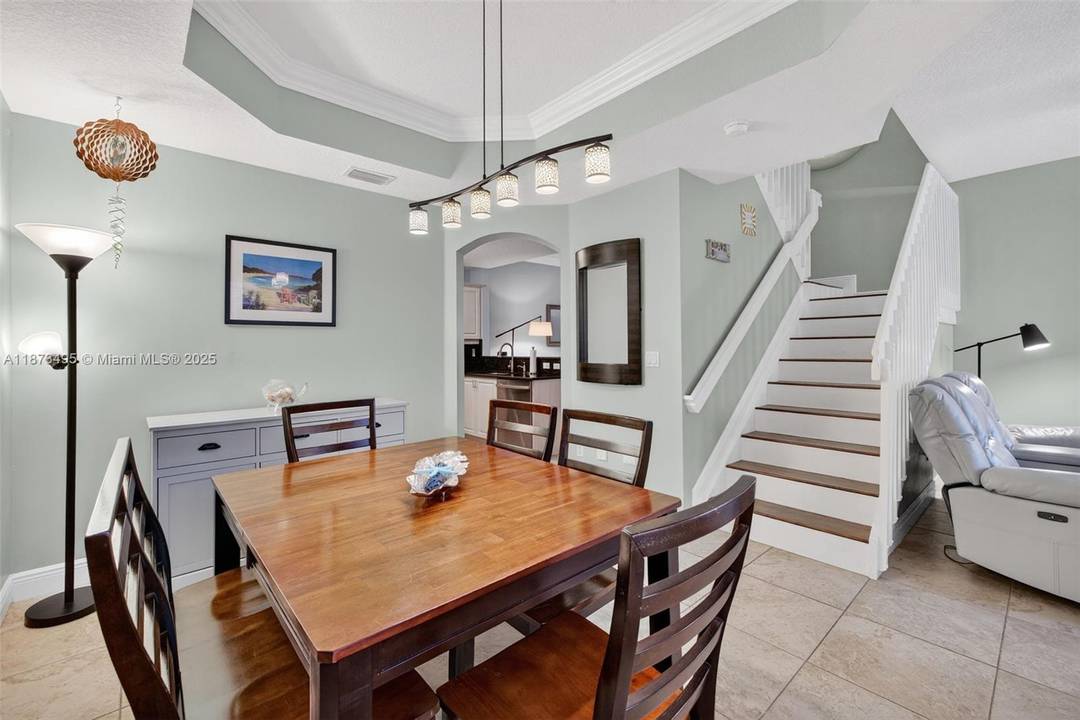 HURRICANE IMPACT GLASS ! Welcome to Villas at Harbor Isles, a lush, gated townhome community that feels like a private country club.