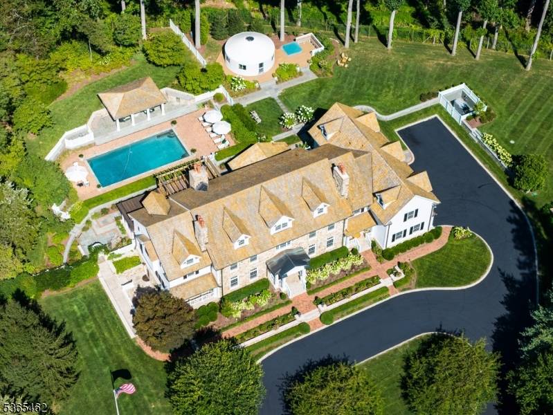 This stunning renovated Mendham estate is a unique property situated on 5.
