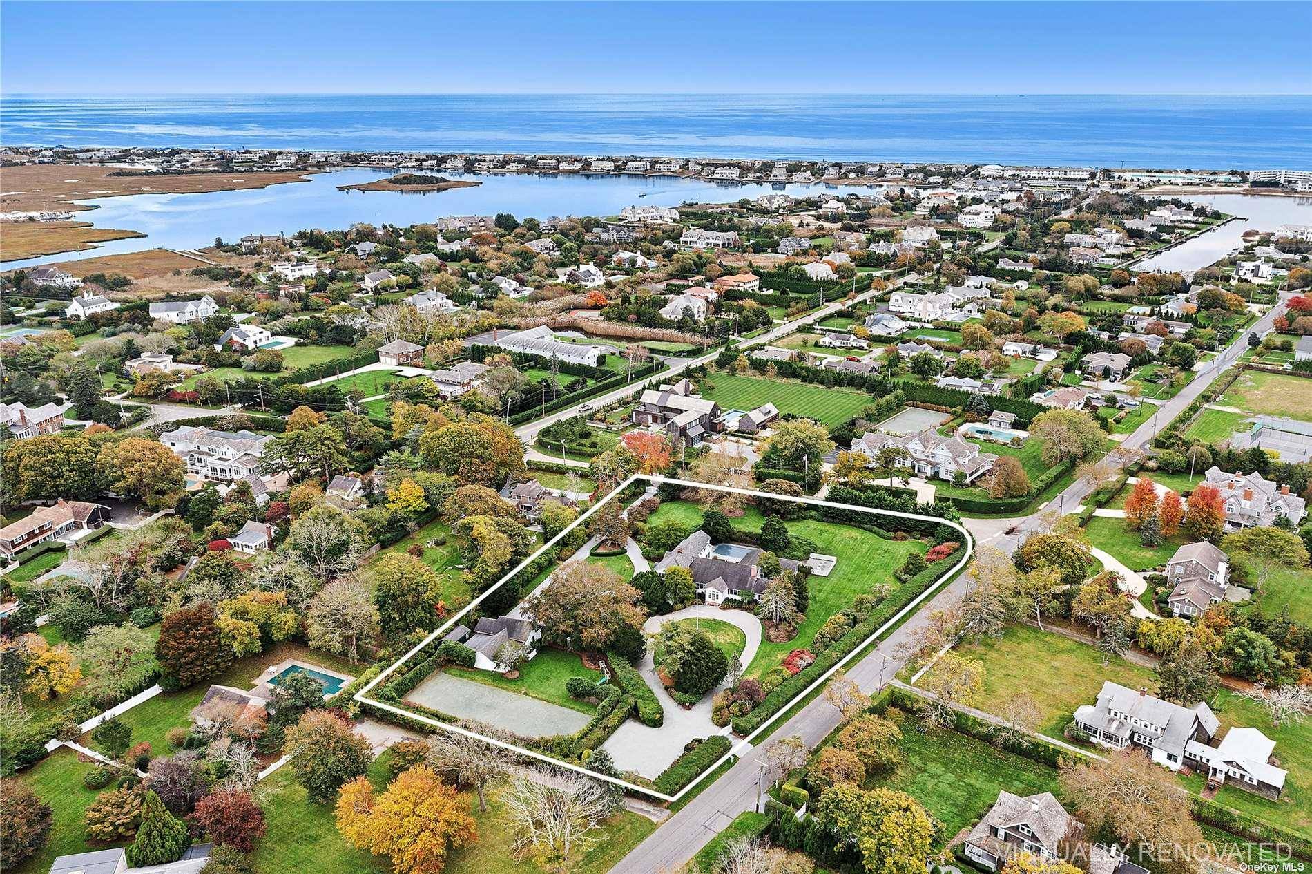 On over two acres, this Village estate is in close proximity to both vibrant Main Street and Dune Road's ocean beaches.