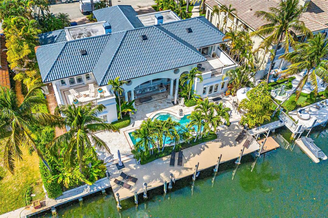 Wake up to serene east facing views in this 5, 700 sq ft waterfront residence in prestigious Nurmi Isles with 100' of deep water dockage.