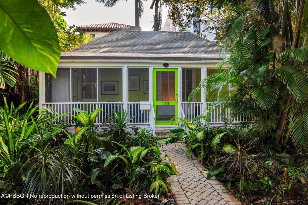 Walk back through time as you approach architect Howard Major's personal cottage nestled in historic Phipps Plaza, one block from the Ocean in midtown Palm Beach.