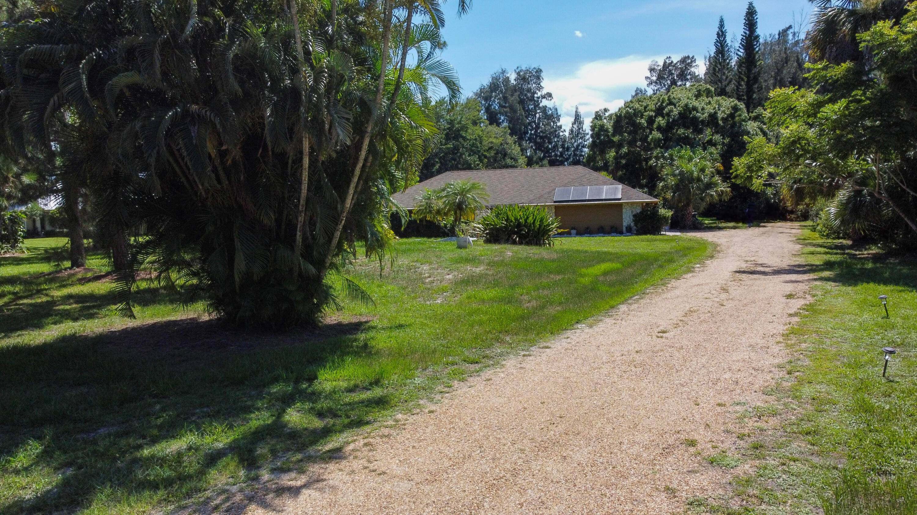 Incredibly RARE opportunity to rent a full home on over an acre of land in Palm City for the Season or off season !