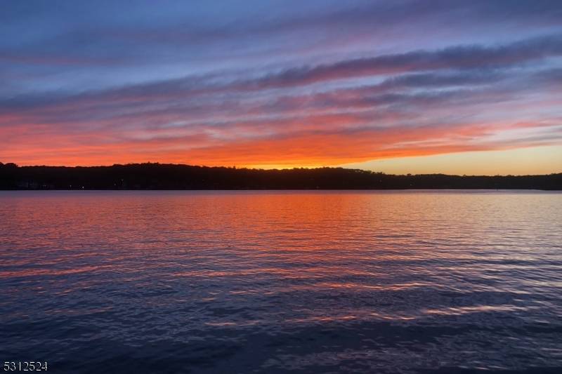 This vintage lake front summer cottage is located on Raccoon Island less than one hour from New York City !