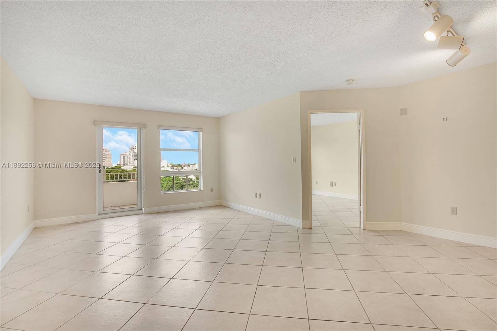 Enjoy beautiful skyline views of Coral Gables from this corner 2 bedroom 2 bathroom unit at sought after Gables Terrace Condominium.