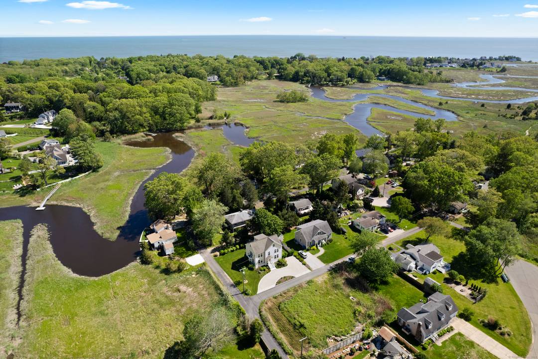 Embrace the enchantment of Shoreline Living at its finest with this sun drenched haven at 3 Arrowhead, a jewel nestled in a quaint community with the river at your doorstep.