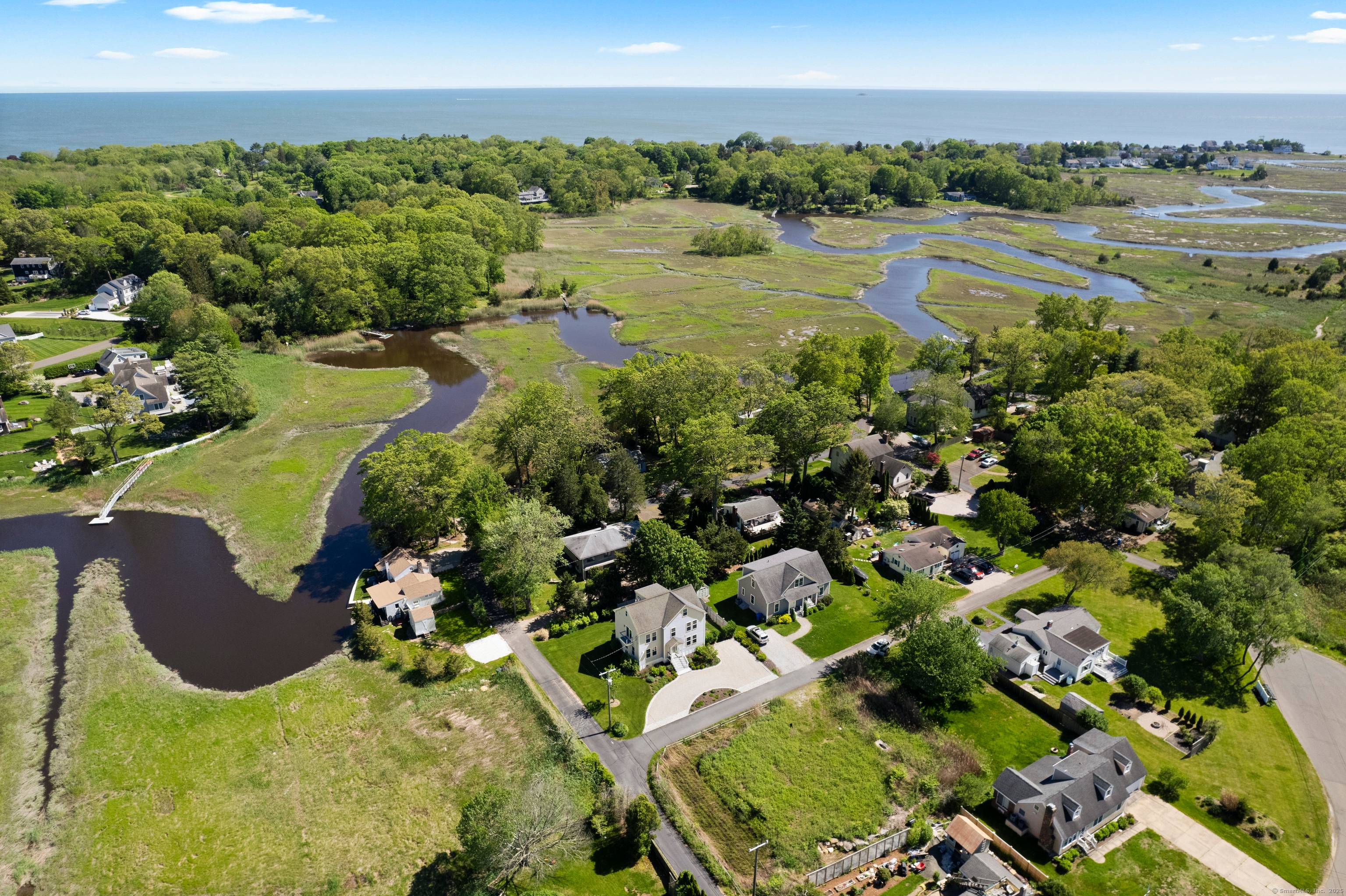 Embrace the enchantment of Shoreline Living at its finest with this sun drenched haven at 3 Arrowhead, a jewel nestled in a quaint community with the river at your doorstep.