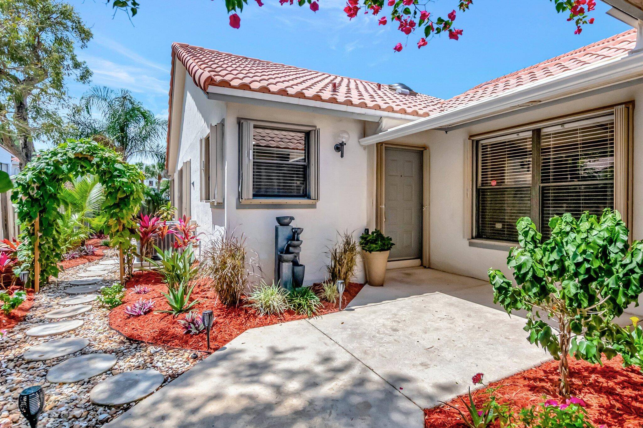 RARELY AVAILABLE ! Immacuately Kept NY Contractor Owned 2 2 SFH Nestled in a Tropical Paradise with No Rear Neighbors !