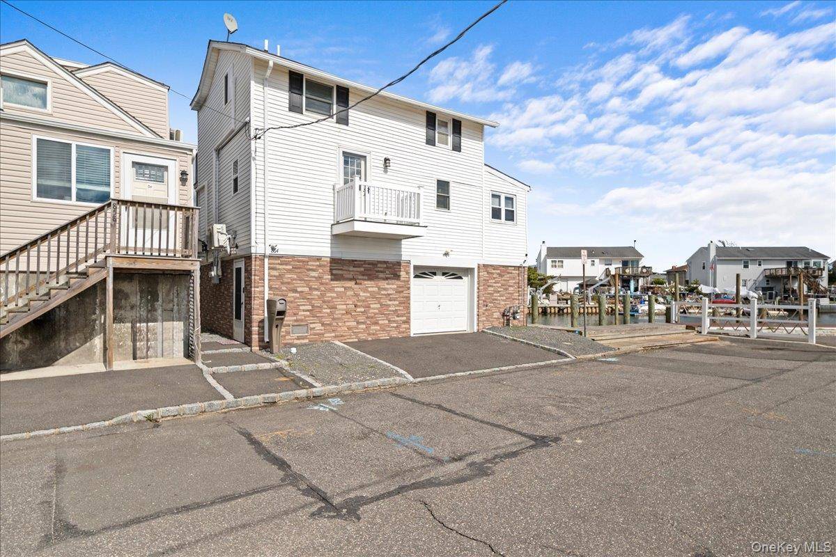 Welcome to 864 S. Walnut Street, a 2 bed 1 bath home with a heated 1 car garage, kitchen, living room, an expansive deck with fabulous view, an elevator !