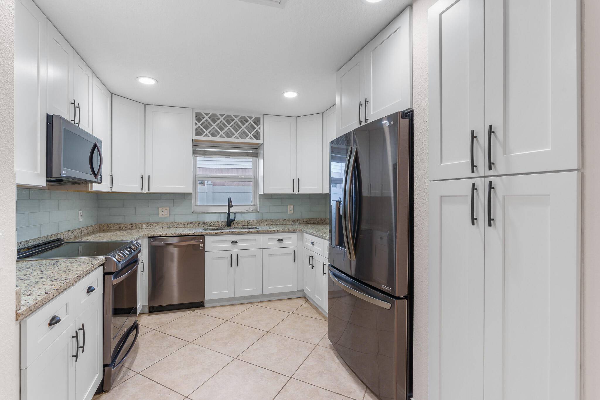 Live your Luxury in Sunny South Florida with this Rarely Available Gem of a Home !