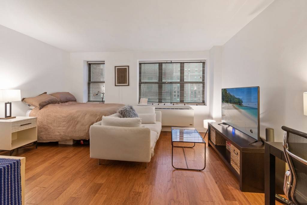 Stunning bright studio in Luxury Building with hardwood floors through out.