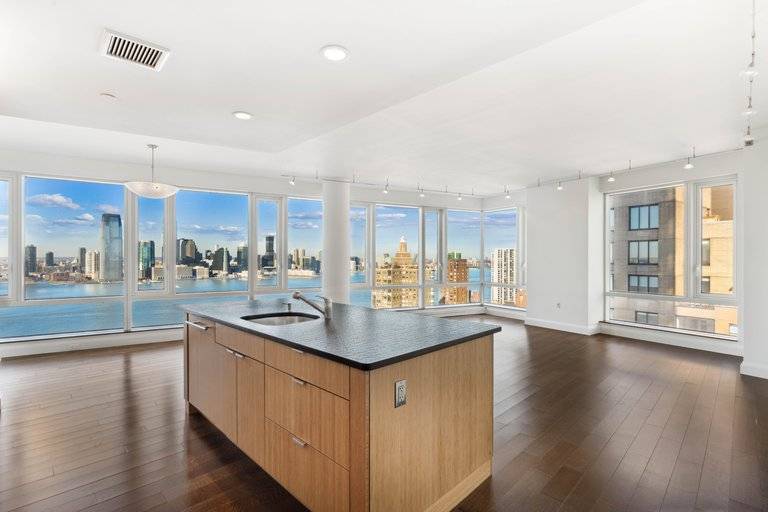 Spectacular 3 bedroom 3 full bath home featuring gorgeous river views, walls of windows and perfectly situated in the heart of Battery Park City.