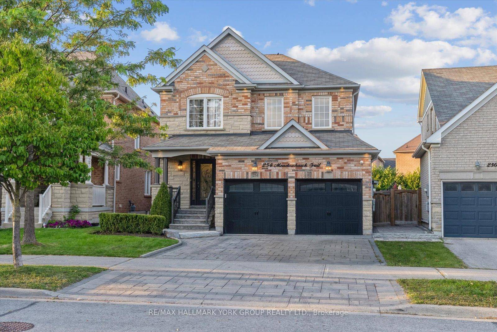 Welcome to this beautifully upgraded executive residence on a premium pie shaped lot, showcasing fabulous curb appeal with an all brick and stone facade, outside potlights and an interlocked driveway.