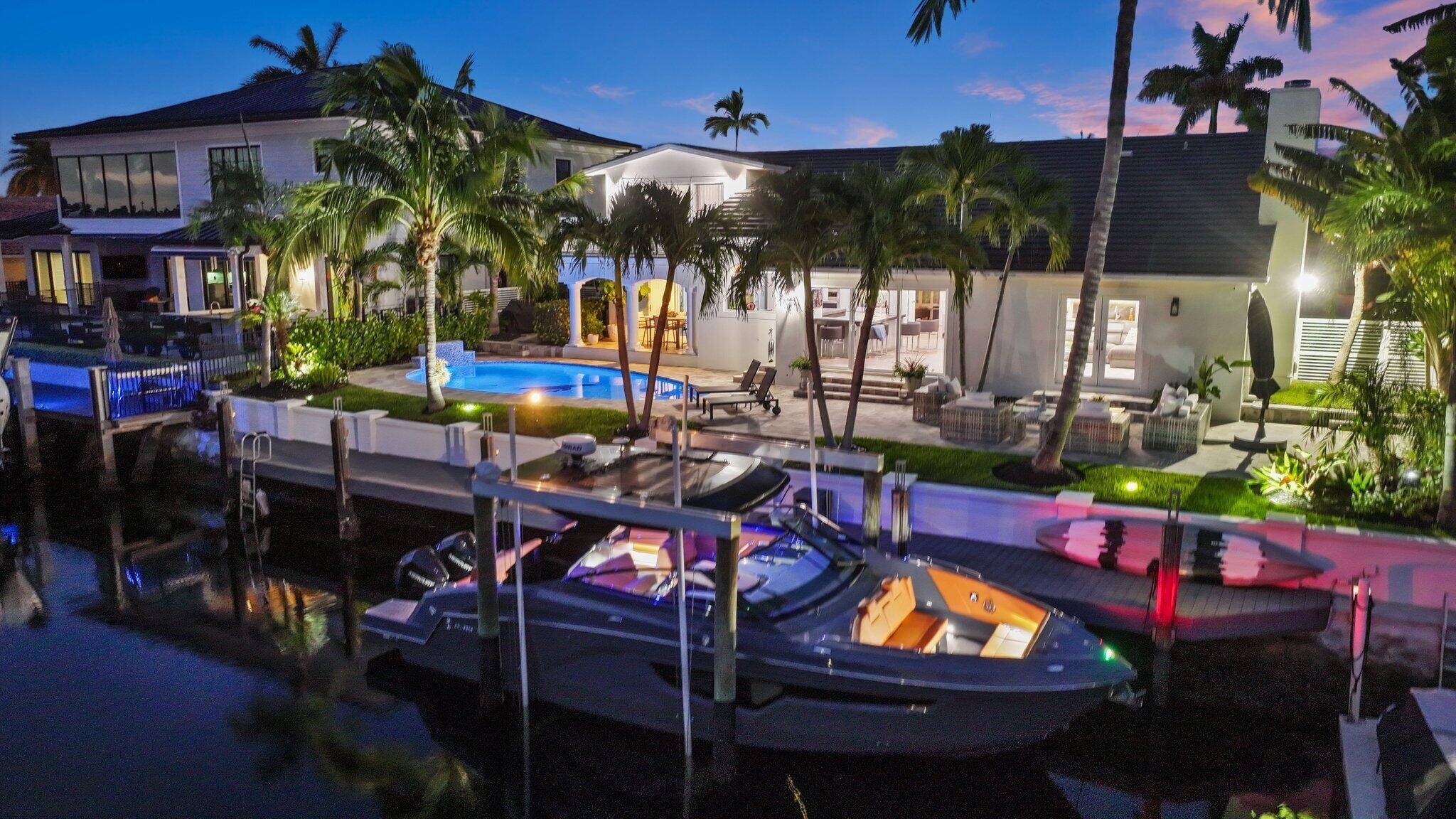 Introducing 4261 NE 24th Avenue, a stunning modern waterfront home in the heart of Lighthouse Point's Venetian Isles' enclave.