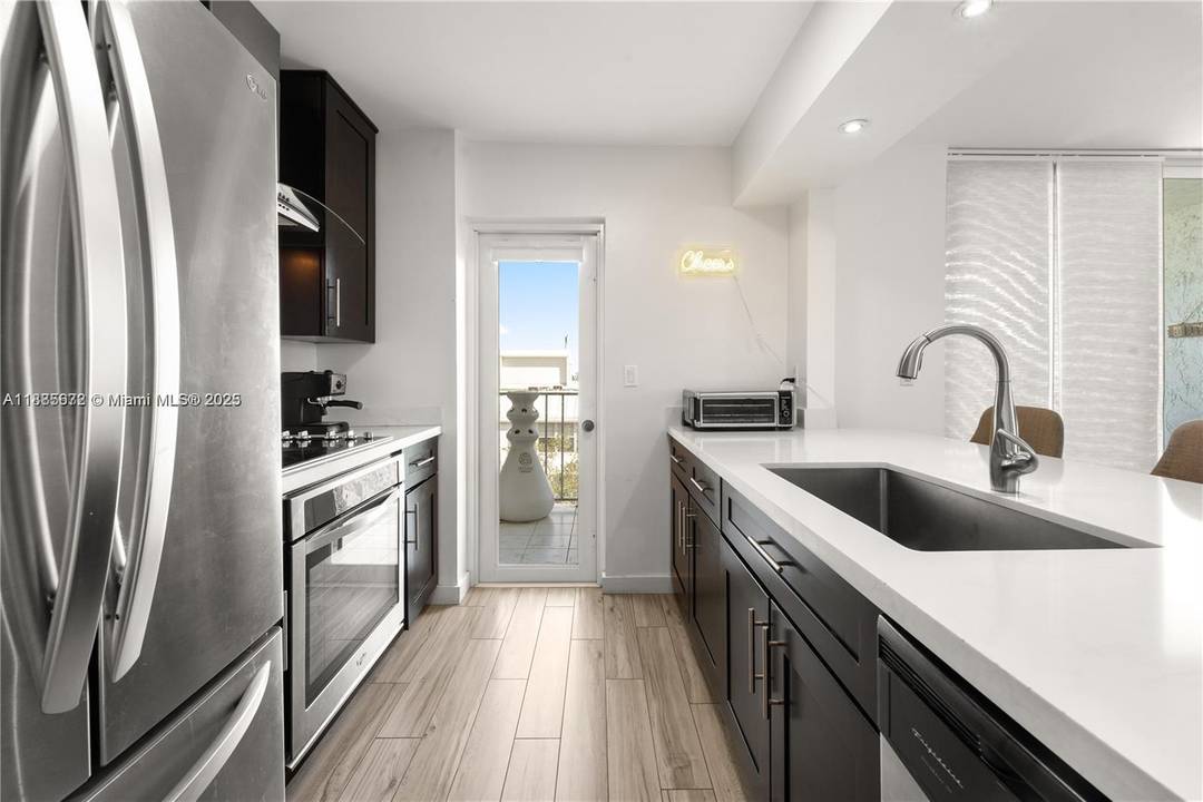 Completely remodeled 1 bedroom, 1 bath corner penthouse in the gated Nirvana community, set directly on the bay in Miami s MiMo District.