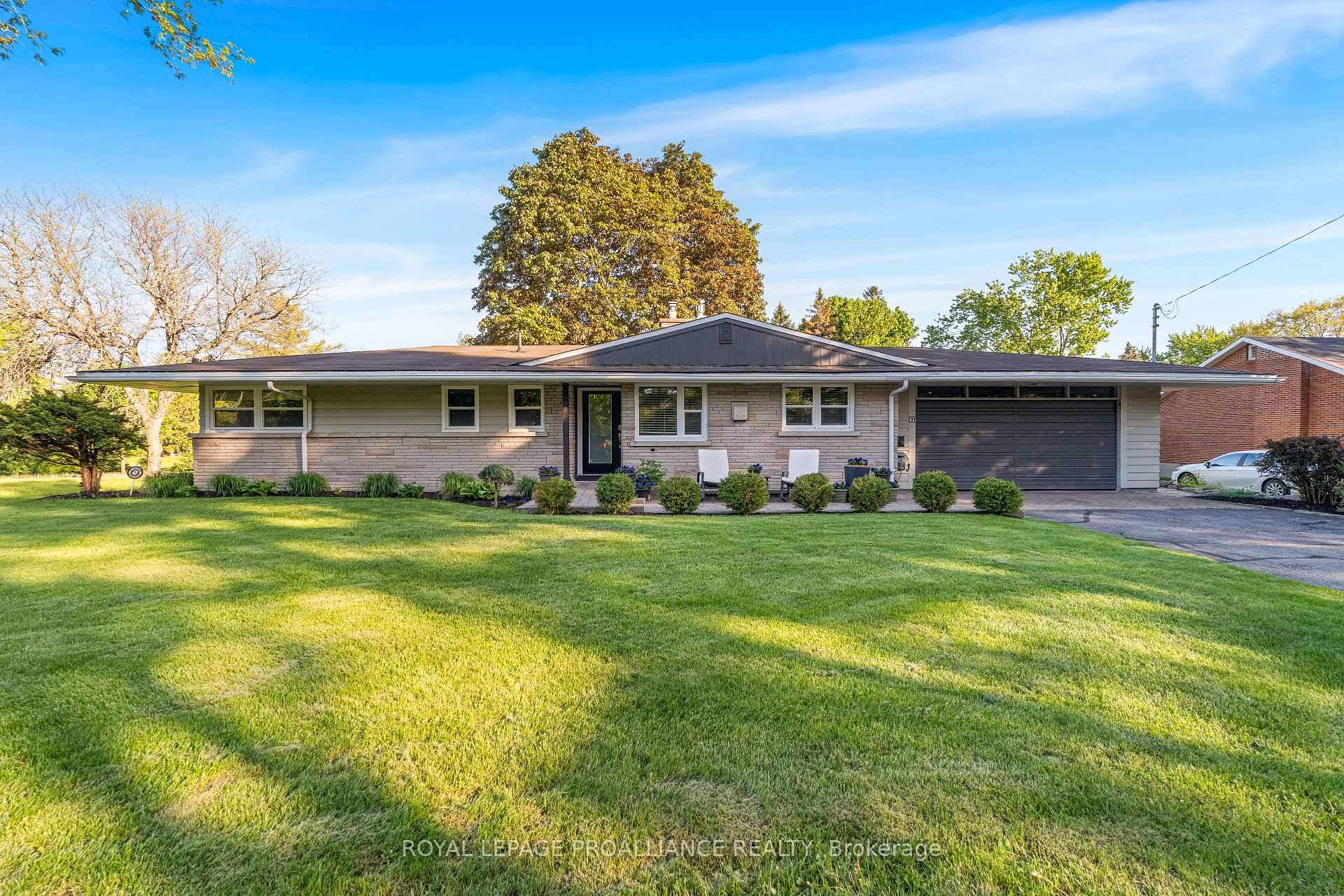 Stately bungalow nestled on a generous lot in a prime West End location.