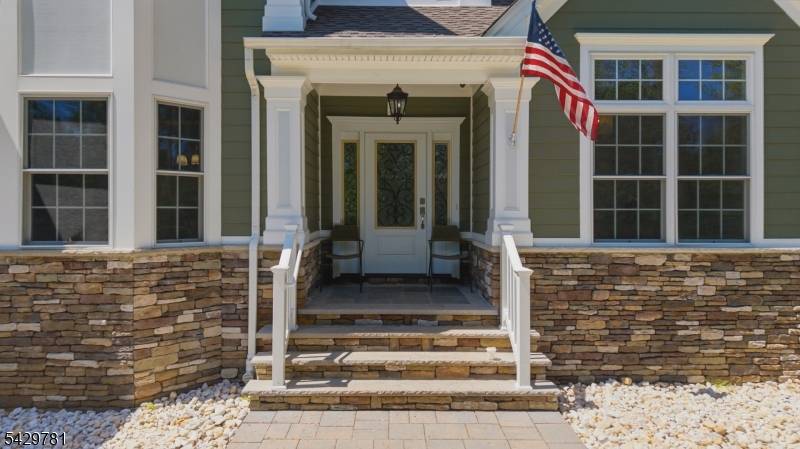 Nestled on over an acre in Watchung's highly coveted Valley View section, this extraordinary center hall colonial blends luxury, tranquility, and timeless elegance.