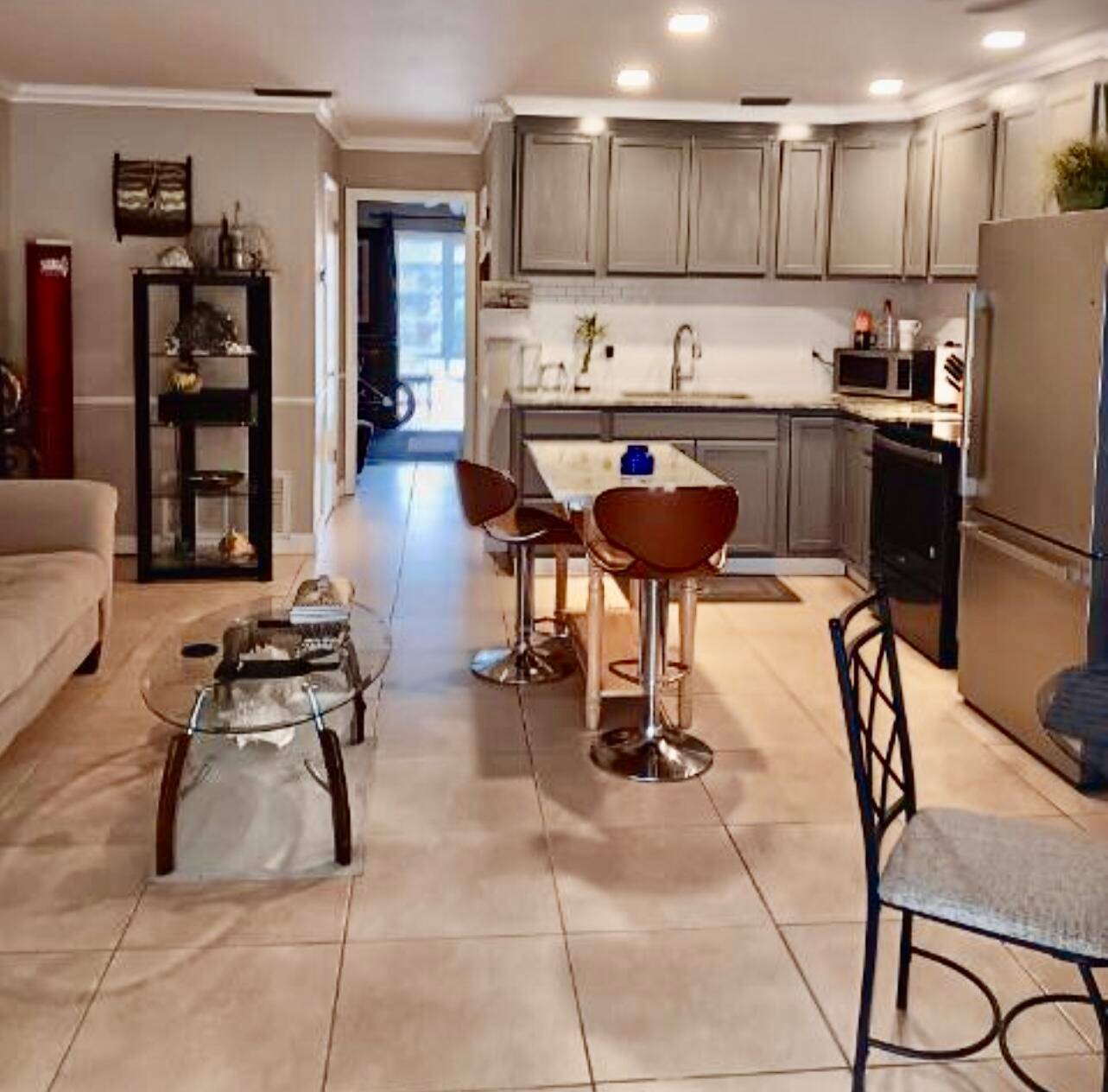 1 BEDROOM, 1 1 2 BATH REMODELED 2ND FLOOR CONDO WITH NEW KITCHEN TILED FLOORS THROUGHOUT.