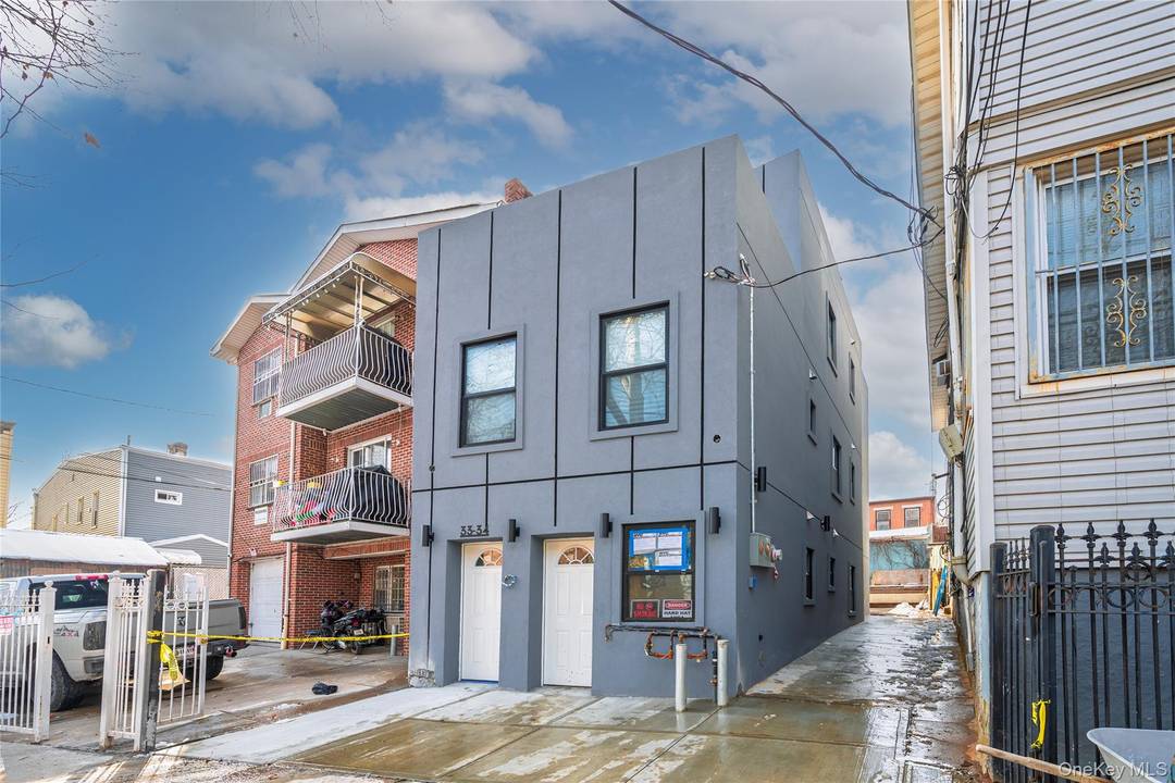 Experience the perfect blend of comfort, convenience, and opportunity with this charming, just renovated 2 family brick home in the heart of Corona.