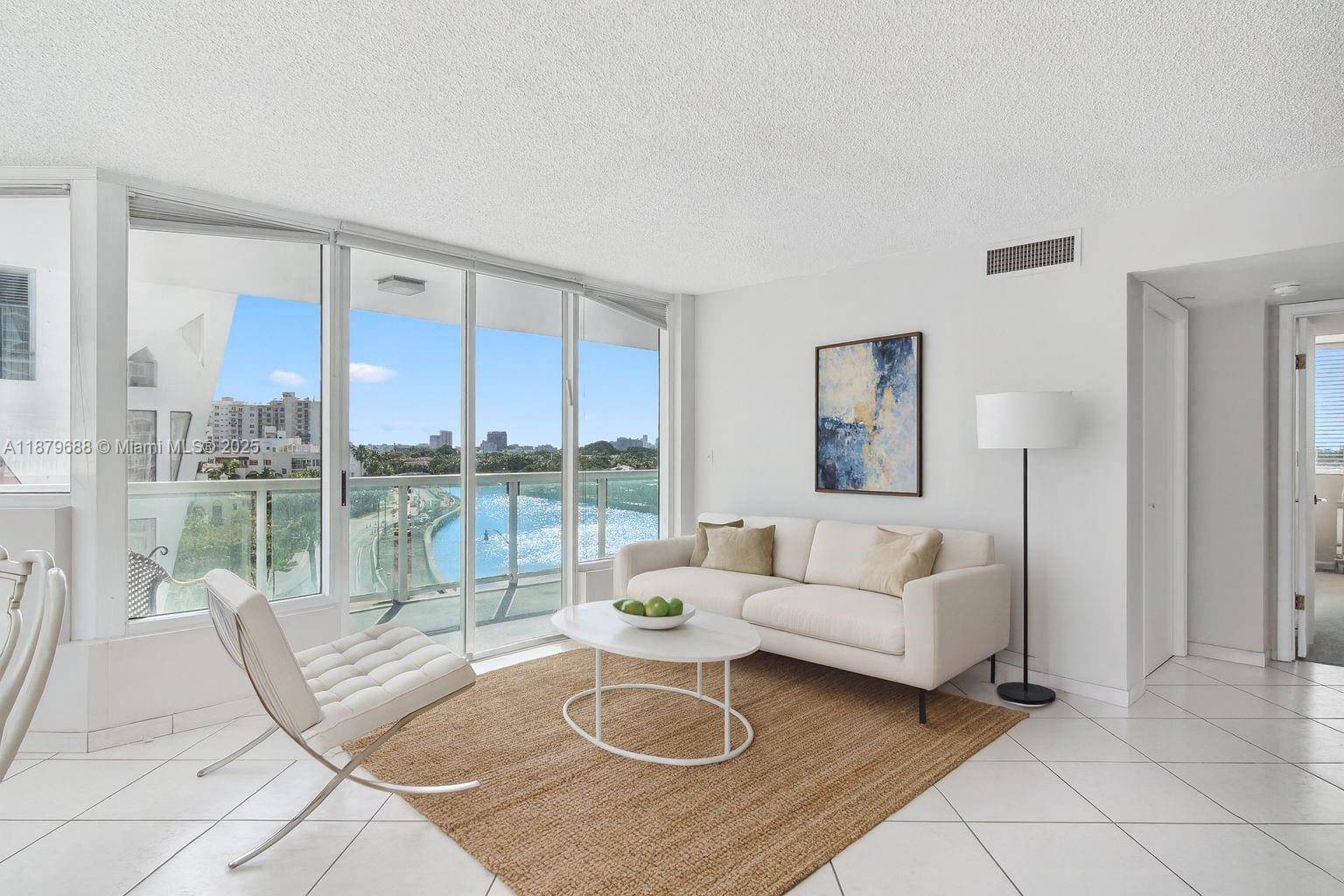 Spacious 2 bedroom, 2 bath corner unit on Indian Creek Drive with extended balcony and beautiful canal views.