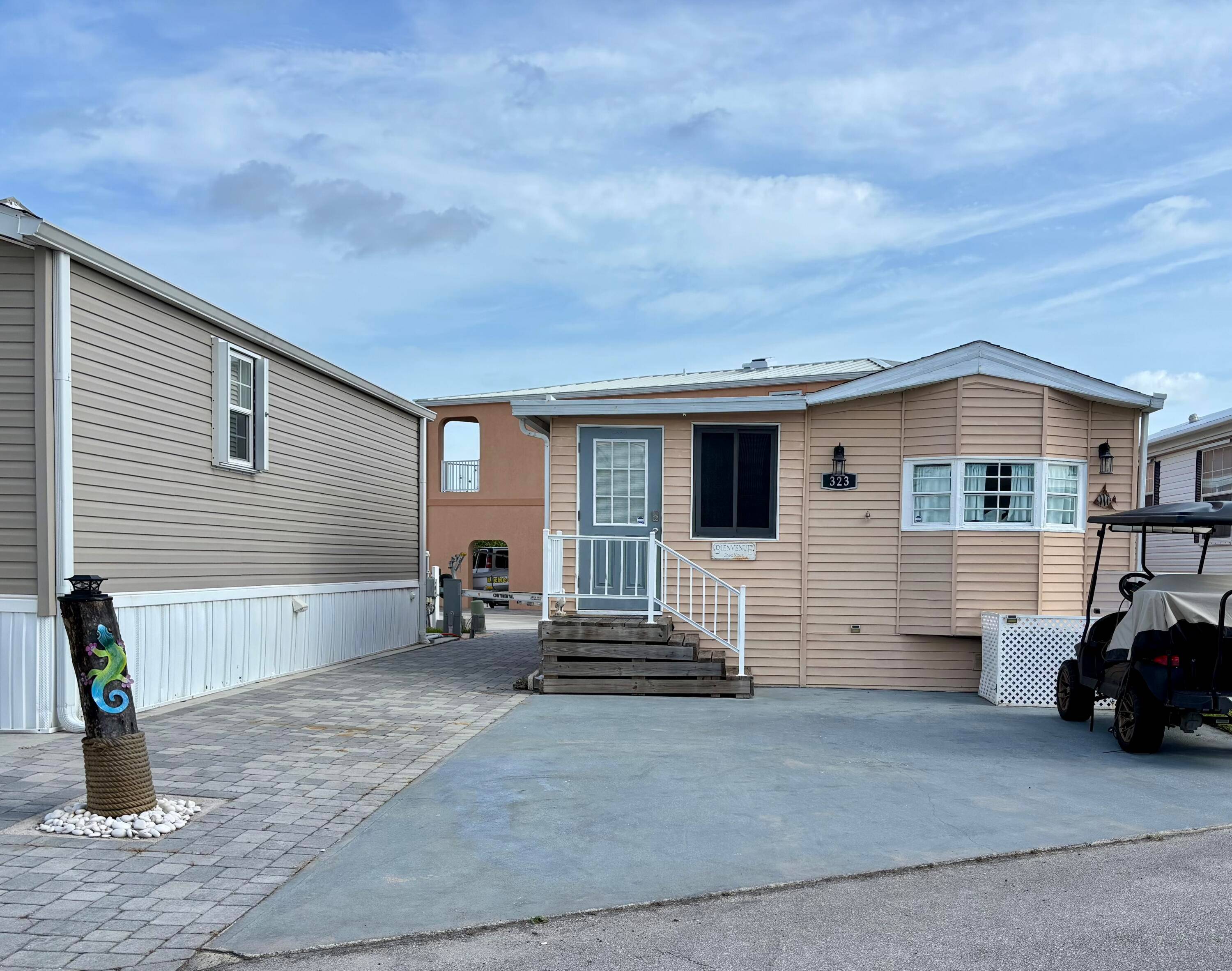 Charming 2BR 1BA beach bungalow on Nettles Island in Jensen Beach, beautifully decorated in coastal decor and just a short walk to the ocean.