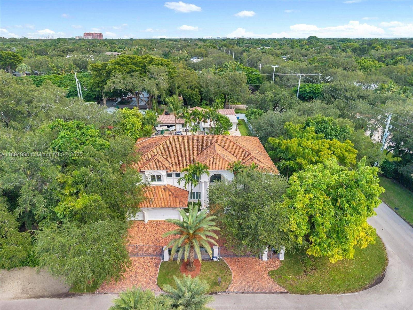 Nestled in High Pines, this privately gated two story home offers 6 bedrooms, 6.