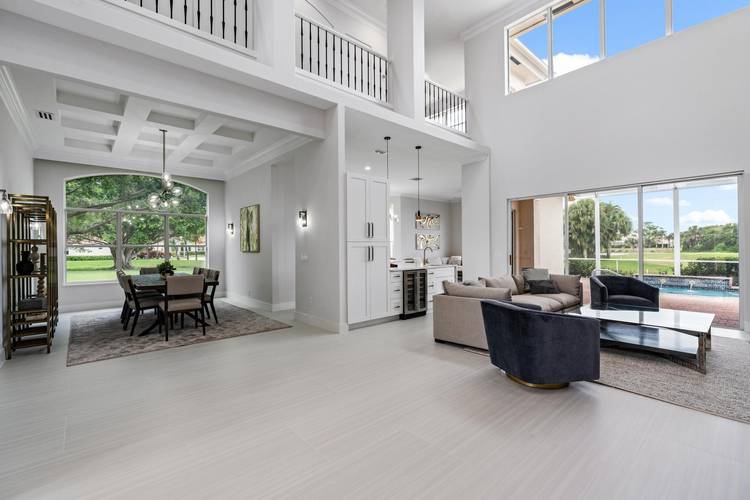 This stunning, renovated estate home is ideally situated within the prestigious, gated enclave of Grand Cay at PGA National Resort amp ; Spa.