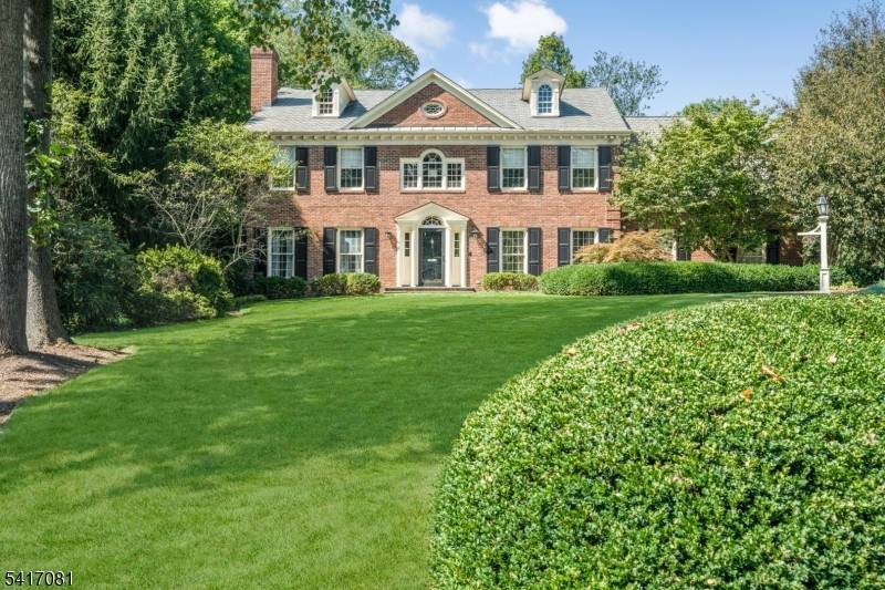 Set back from the street with a long tree lined approach, this timeless Georgian brick Colonial makes an immediate impression with its symmetry, scale and quiet confidence.