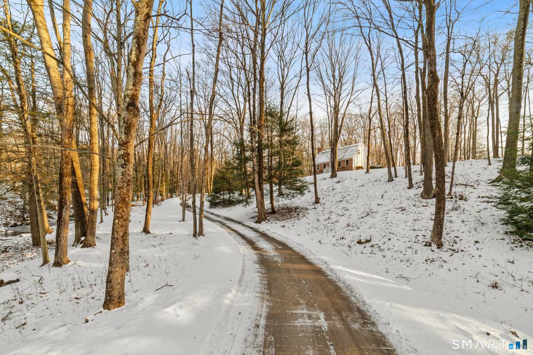 This charming Colonial home offers a blend of classic design and modern amenities on a generous 3 acre lot.