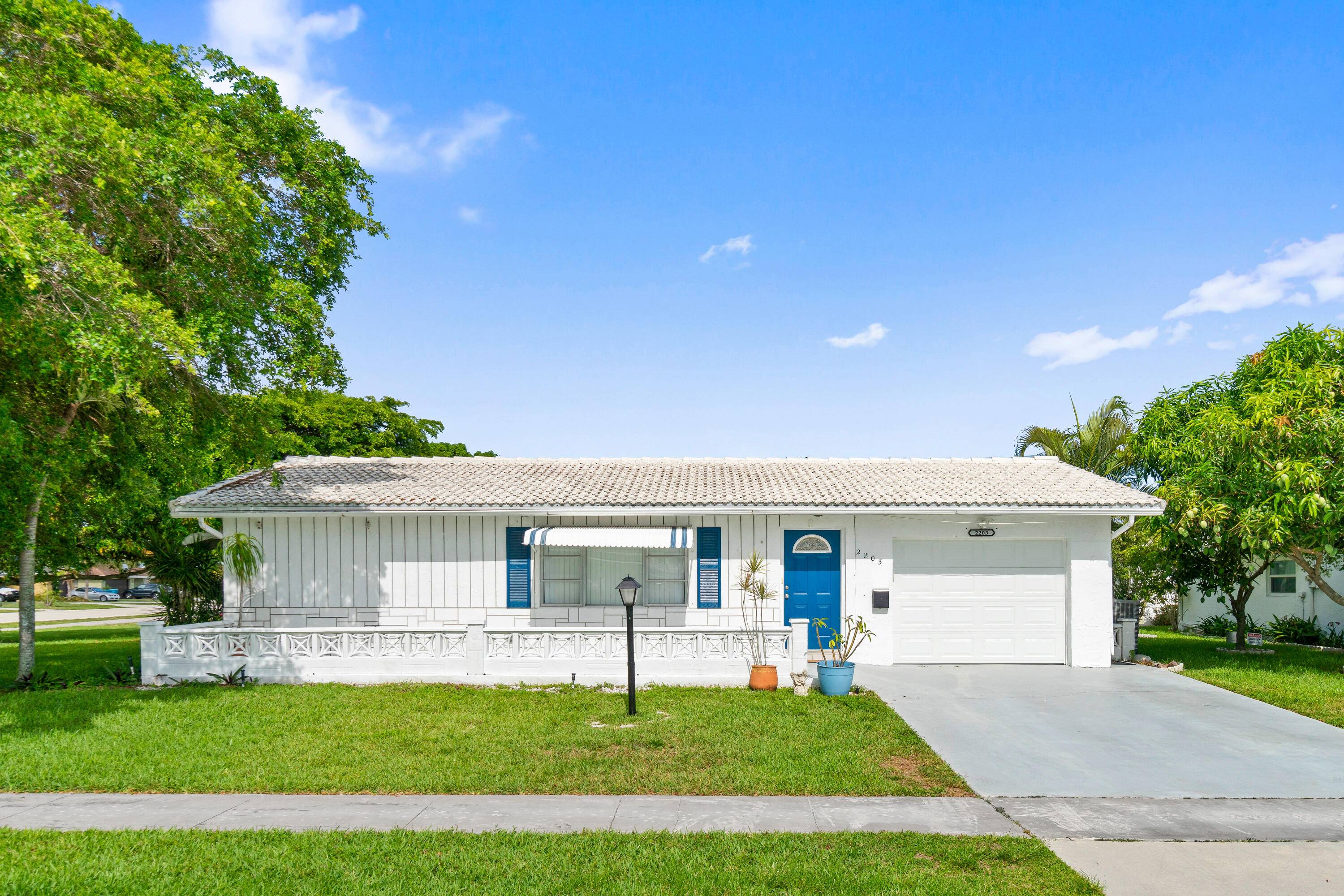 This beloved Challenger model is located on a sun kissed corner lot in one of Boynton Beach's most sought after 55 communities ; Leisureville.