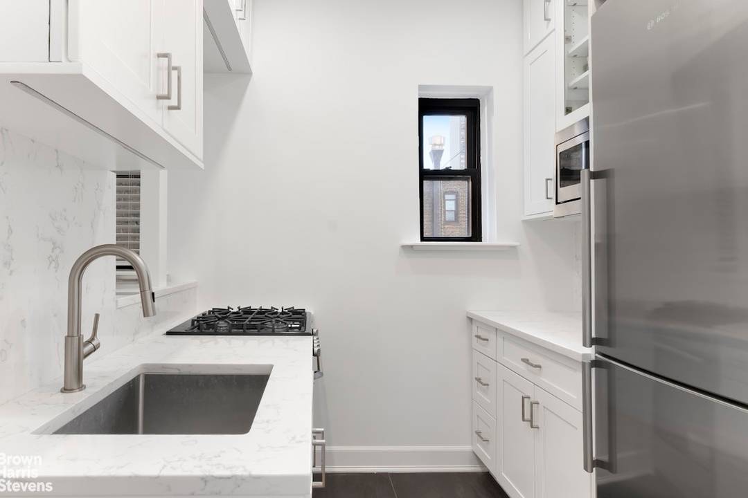 INVESTOR FRIENDLY RENT FROM DAY ONE This triple mint, fully renovated one bedroom offers a seamless blend of modern design and functionality.