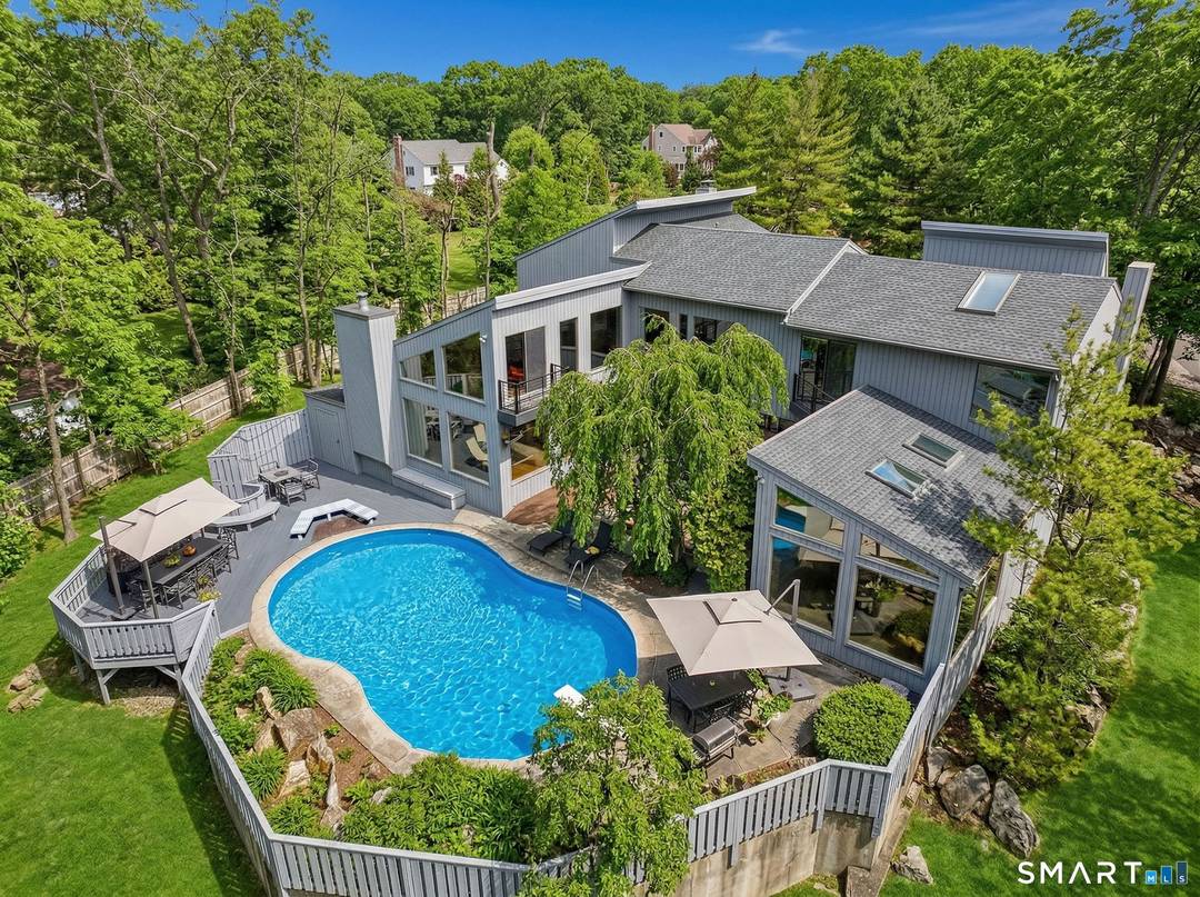 A distinctive architectural statement offering a rare blend of design, scale, and lifestyle, set in the highly desirable Nichols section of Trumbull with deeded rights to Dogwood Lake.